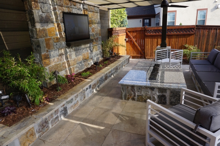 stone patio with outdoor fire pit in lowry, co