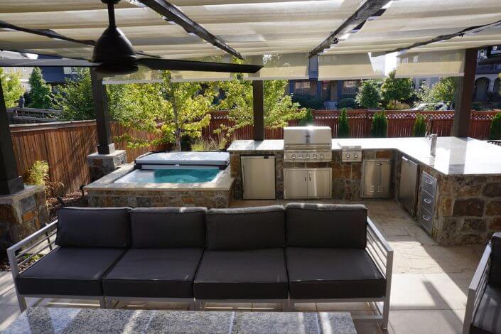 Hot tub with pergola outdoor kitchen paver patio fireplace hot tub lowry co