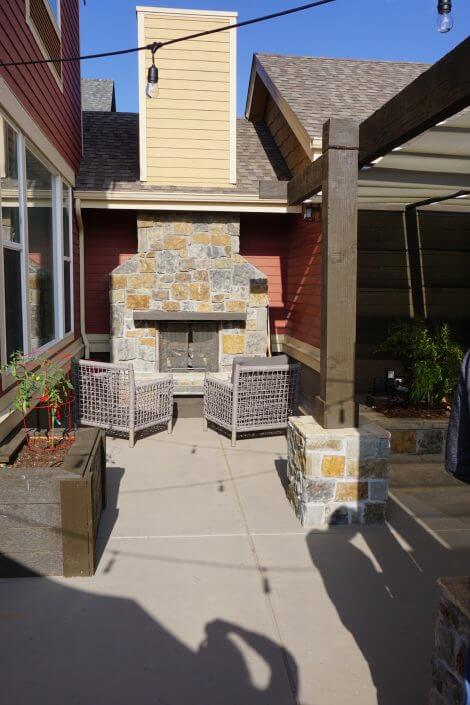 Hot tub with pergola outdoor kitchen paver patio fireplace hot tub lowry co