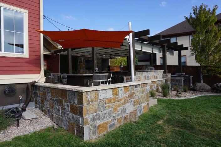 Hot tub with pergola outdoor kitchen paver patio fireplace hot tub lowry co