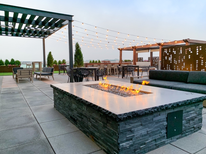 Rooftop patio with fire pit and pergola in Cherry Creek