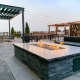 Rooftop patio with fire pit and pergola in Cherry Creek