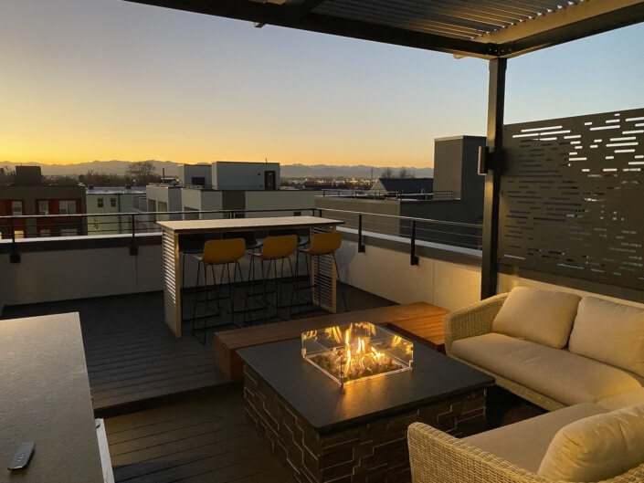 rooftop deck steel pergola privacy screening fire pit outdoor dining denver co