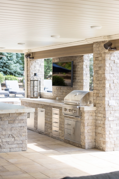 covered outdoor kitchen and tv in centennial, co